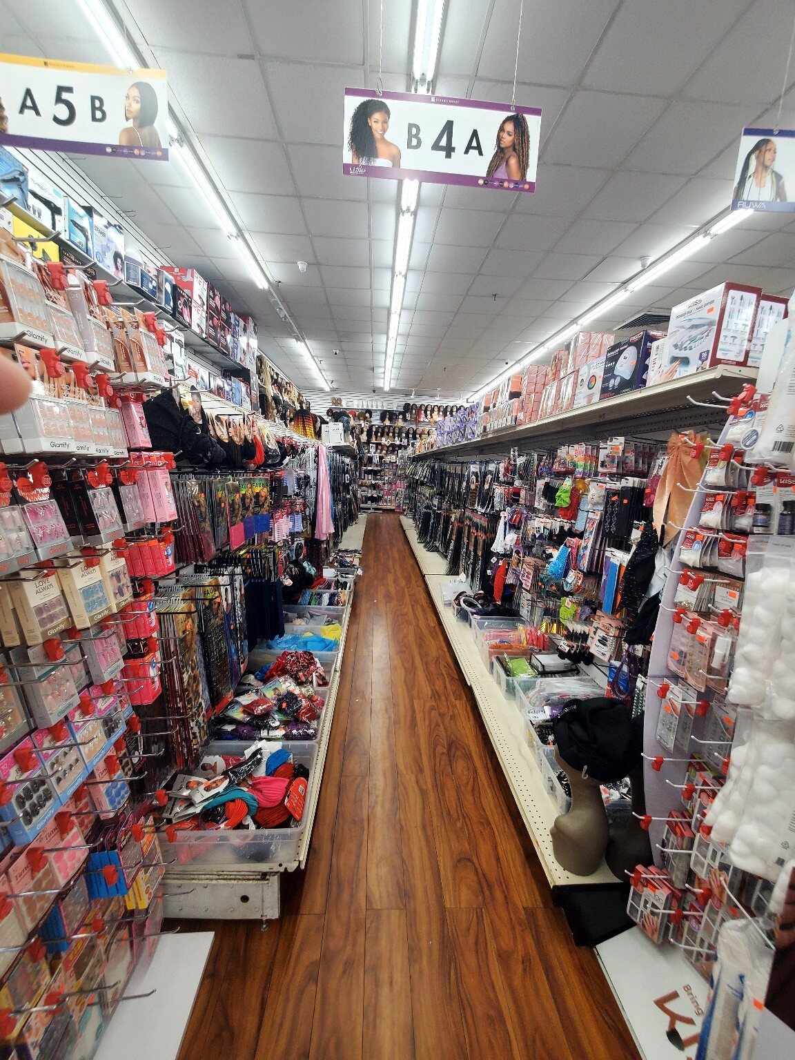 Store aisle showing the selection at One Plaza Beauty Supply